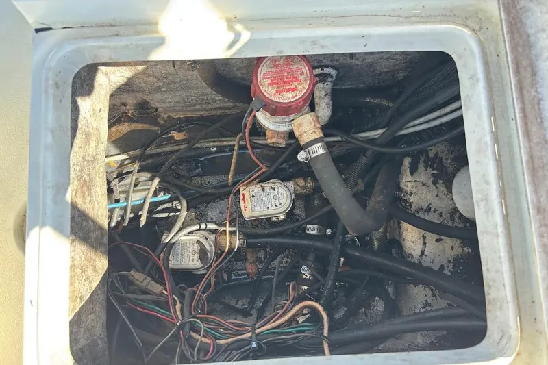 Slide: The Image of Electrical wiring and components inside a 2009 Ranger Banshee boat compartment. - 19
