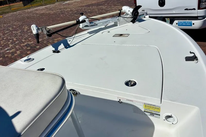 Slide: The Image of 2009 Ranger Banshee boat deck with trolling motor, parked on brick pavement. - 21