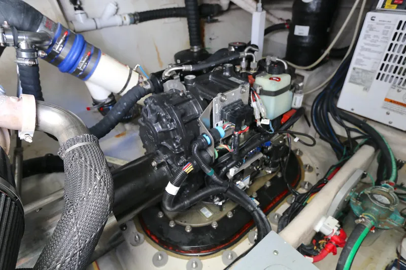 Slide: The Image of Engine room of a 2013 Meridian 441 Sedan yacht, showcasing mechanical components and wiring. - 16