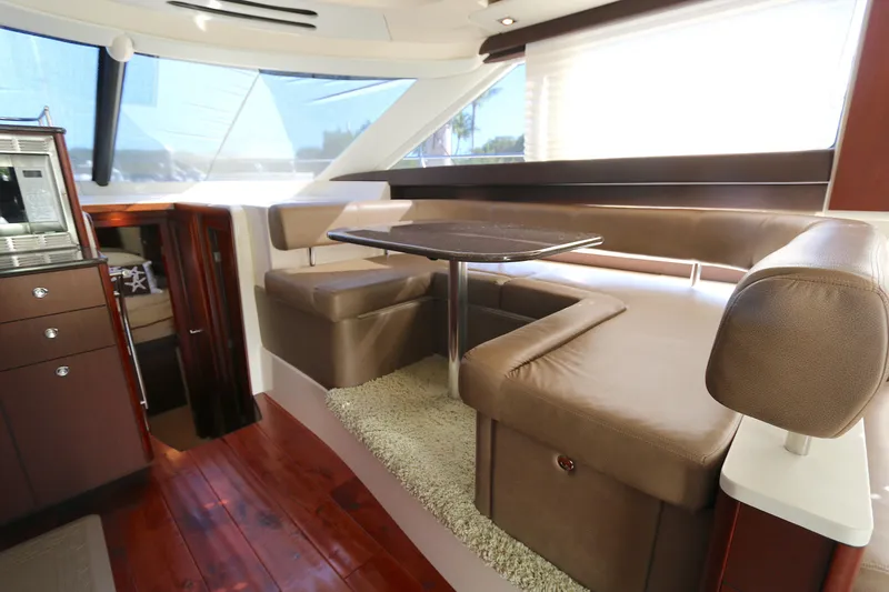 Slide: The Image of Luxurious interior of 2013 Meridian 441 Sedan yacht with leather seating and wooden flooring. - 3
