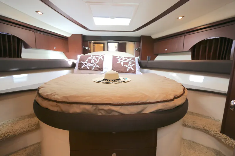 Slide: The Image of Luxurious 2013 Meridian 441 Sedan yacht bedroom with elegant decor and cozy bedding. - 6