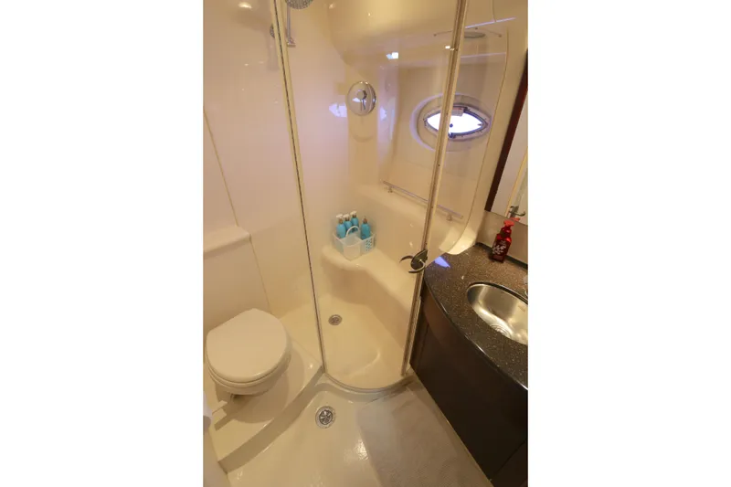 Slide: The Image of Bathroom interior of 2013 Meridian 441 Sedan yacht, featuring shower, toilet, and sink. - 8