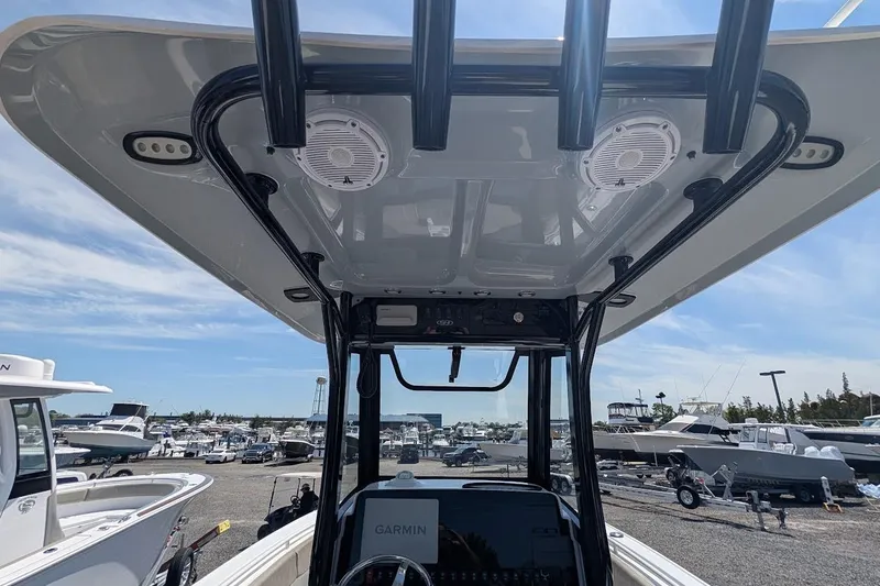 Slide: The Image of Interior view of 2025 Sea Hunt Ultra 255 SE boat's control panel with Garmin equipment. - 15