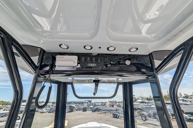 Slide: The Image of Trim tab control panel on 2025 Sea Hunt Ultra 255 SE boat. - 16