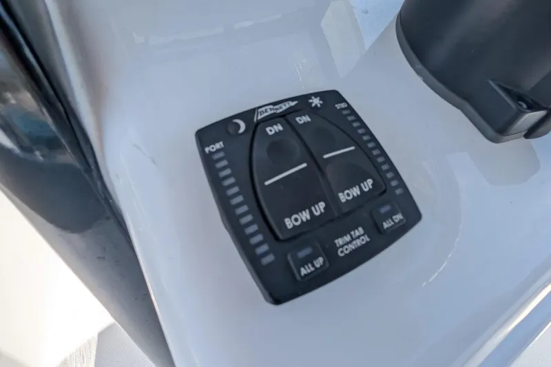 Slide: The Image of 2025 Sea Hunt Ultra 255 SE boat bathroom with compact toilet and storage features. - 17