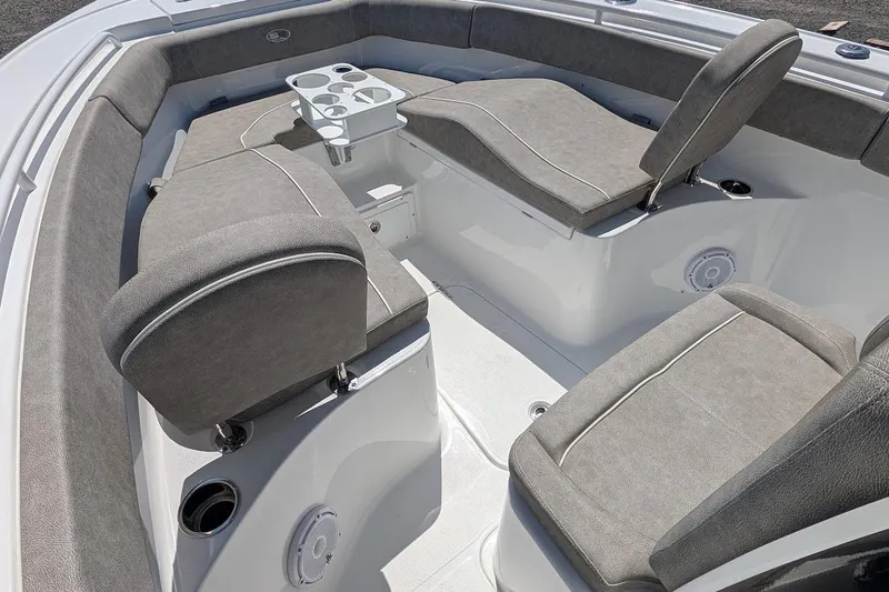Slide: The Image of 2025 Sea Hunt Ultra 255 SE boat interior view at a marina. - 19