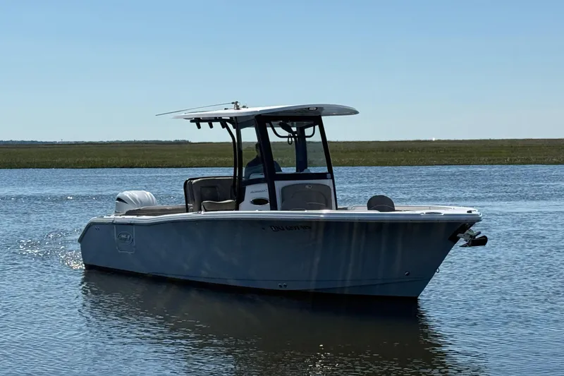 Slide: The Image of 2025 Sea Hunt Ultra 255 SE boat with gray cushioned seating. - 5