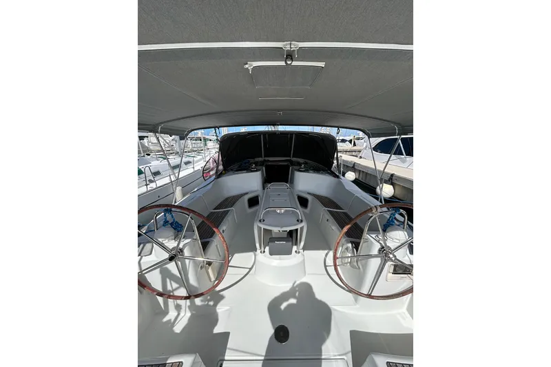Slide: The Image of Instrument panel of 2011 Jeanneau Sun Odyssey 44i sailboat with Yanmar gauge and warning label. - 14