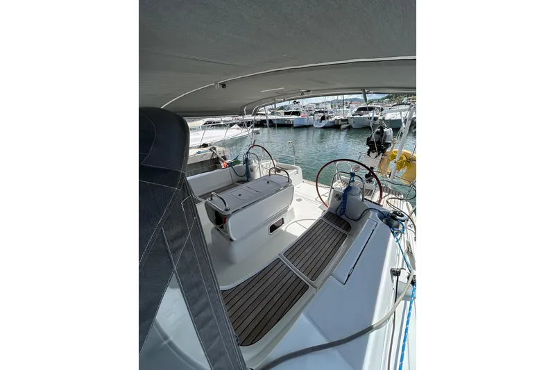 Slide: The Image of Cockpit view of 2011 Jeanneau Sun Odyssey 44i sailboat with dual steering wheels. - 15