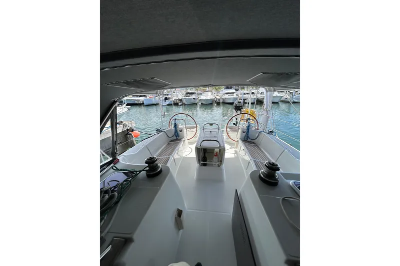 Slide: The Image of Cockpit view of 2011 Jeanneau Sun Odyssey 44i sailboat docked at marina. - 16