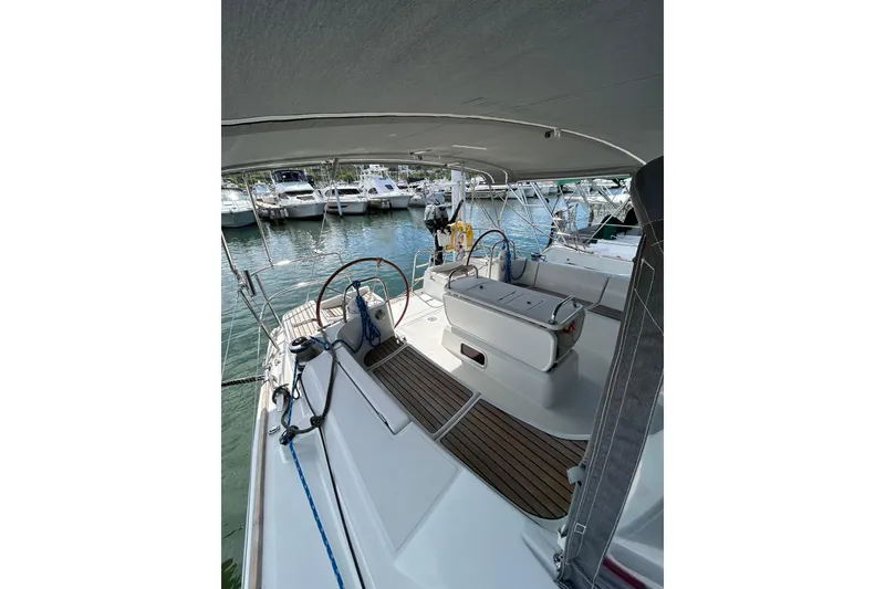 Slide: The Image of Cockpit view of 2011 Jeanneau Sun Odyssey 44i sailboat docked at marina. - 17