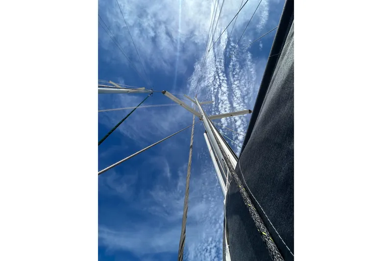 Slide: The Image of 2011 Jeanneau Sun Odyssey 44i sailboat docked at marina under blue sky. - 19