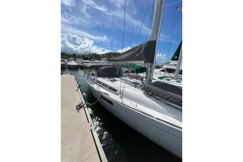 Slide: The Image of Looking up at the mast of a 2011 Jeanneau Sun Odyssey 44i sailboat against a blue sky. - 20
