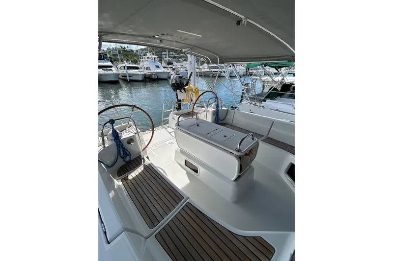 Slide: The Image of Sailboat Jeanneau Sun Odyssey 44i, 2011 model, docked in a marina under a blue sky. - 3