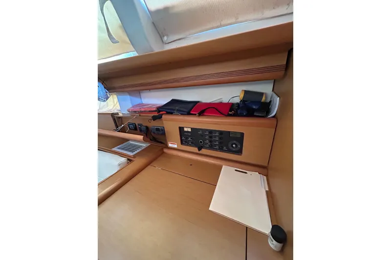 Slide: The Image of Interior of 2011 Jeanneau Sun Odyssey 44i yacht with navigation station and storage. - 36