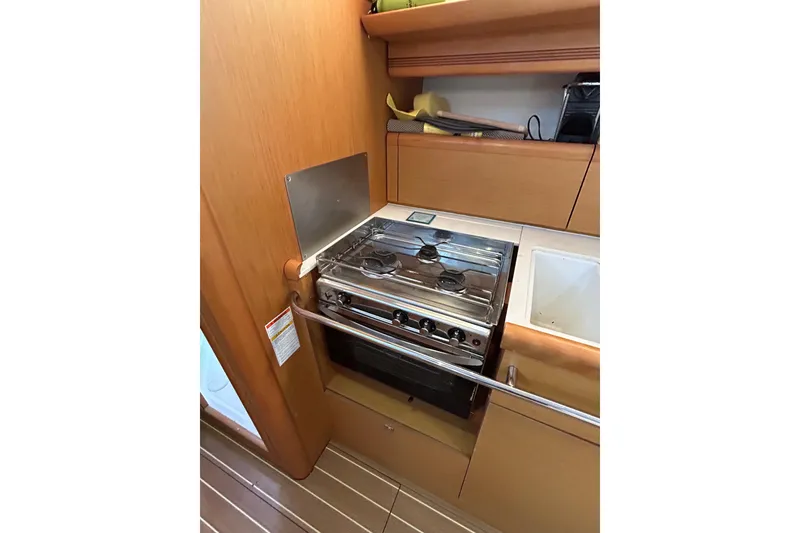 Slide: The Image of Interior view of 2011 Jeanneau Sun Odyssey 44i yacht navigation station. - 37