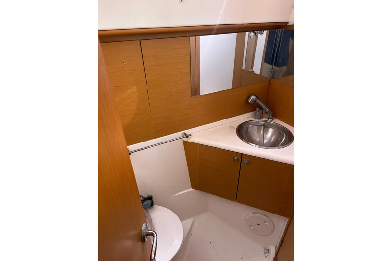 Slide: The Image of Galley kitchen in 2011 Jeanneau Sun Odyssey 44i sailboat with stove and sink. - 38