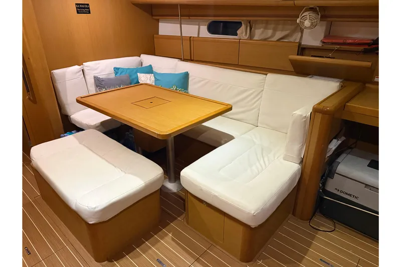 Slide: The Image of Interior of 2011 Jeanneau Sun Odyssey 44i yacht with cozy seating and wooden table. - 41