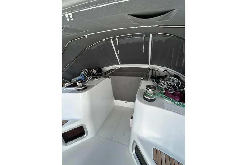 Slide: The Image of 2011 Jeanneau Sun Odyssey 44i sailboat deck view at marina, clear sky background. - 5