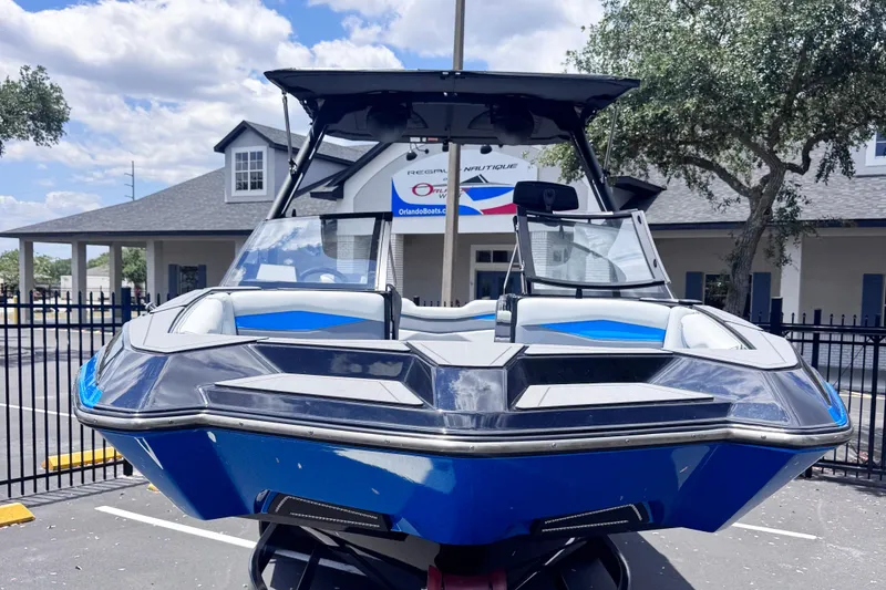 Slide: The Image of 2025 Axis A245 boat in a parking lot, showcasing sleek design and modern features. - 3