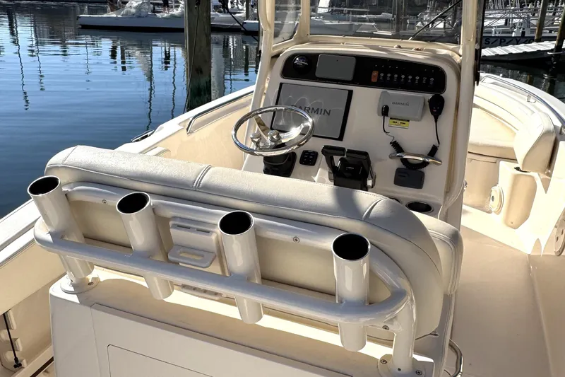 Slide: The Image of 2017 Grady-White Fisherman 257 boat console with steering wheel and rod holders. - 10