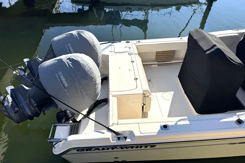 Slide: The Image of 2017 Grady-White Fisherman 257 boat with Yamaha engines, docked in water. - 4