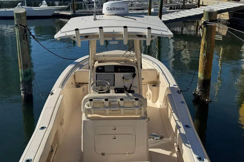 Slide: The Image of 2017 Grady-White Fisherman 257 boat docked, featuring Garmin navigation system. - 7