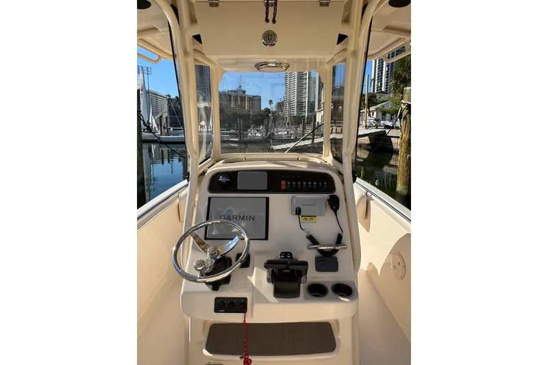 Slide: The Image of 2017 Grady-White Fisherman 257 boat helm with Garmin navigation system, docked in marina. - 8