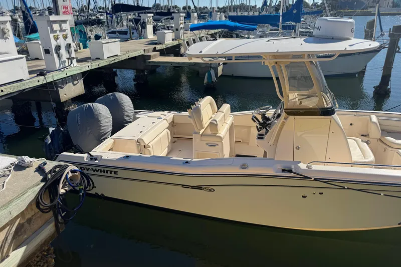 Slide: The Image of 2017 Grady-White Fisherman 257 boat docked at marina with twin engines. - 9