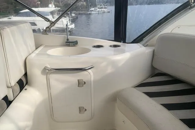 Slide: The Image of Interior of 2006 Meridian 411 Sedan yacht with seating and sink area. - 10