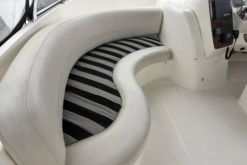 Slide: The Image of Interior seating of a 2006 Meridian 411 Sedan boat with striped cushions. - 11