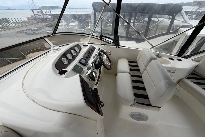 Slide: The Image of Interior of 2006 Meridian 411 Sedan yacht with steering console and seating. - 13