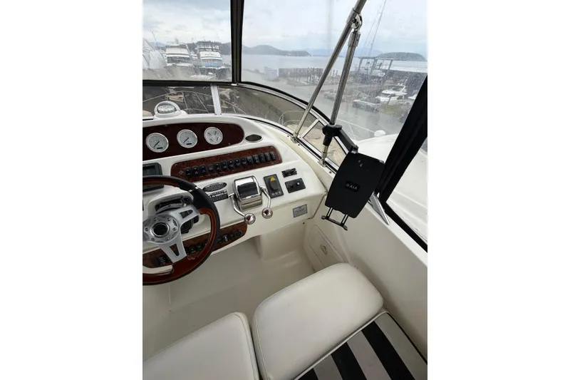 Slide: The Image of Interior view of 2006 Meridian 411 Sedan yacht cockpit with steering wheel and control panel. - 20