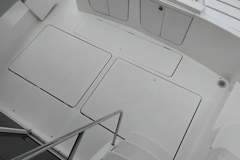 Slide: The Image of 2006 Meridian 411 Sedan boat deck with storage compartments and steps. - 23