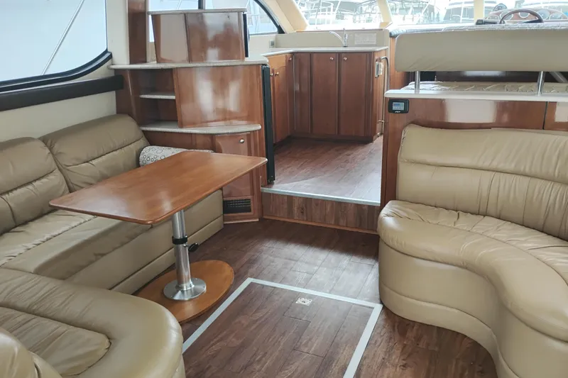 Slide: The Image of Interior of a 2006 Meridian 411 Sedan yacht with leather seating and wooden finishes. - 27