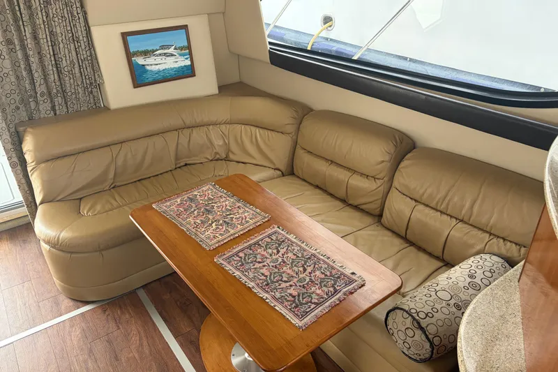 Slide: The Image of Luxurious interior of 2006 Meridian 411 Sedan with leather seating and wooden table. - 29
