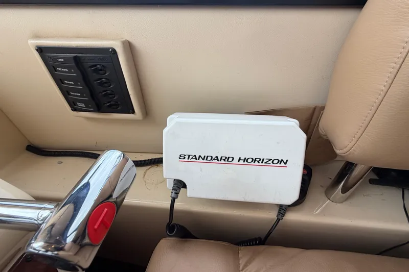 Slide: The Image of Control panel and Standard Horizon device in 2006 Meridian 411 Sedan boat interior. - 40