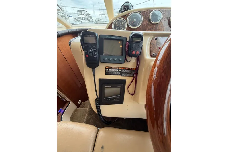 Slide: The Image of 2006 Meridian 411 Sedan helm with navigation equipment and control panel. - 41