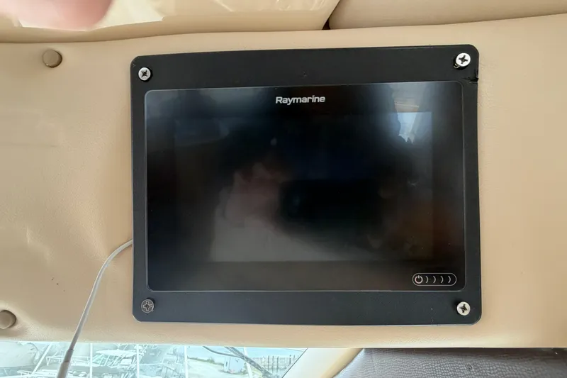 Slide: The Image of Raymarine display on 2006 Meridian 411 Sedan boat dashboard. - 42