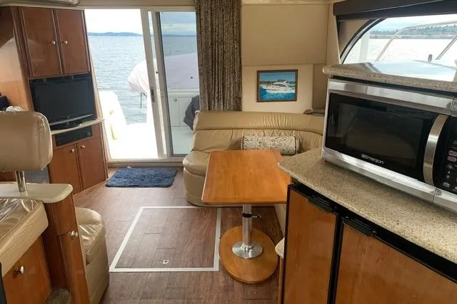 Slide: The Image of Interior of 2006 Meridian 411 Sedan yacht with cozy seating and modern amenities. - 45