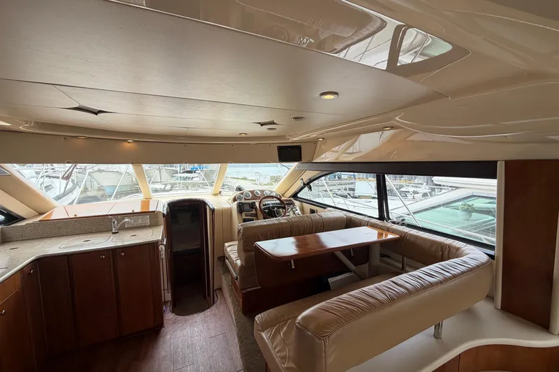 Slide: The Image of Interior of a 2006 Meridian 411 Sedan yacht with luxurious seating and helm. - 48