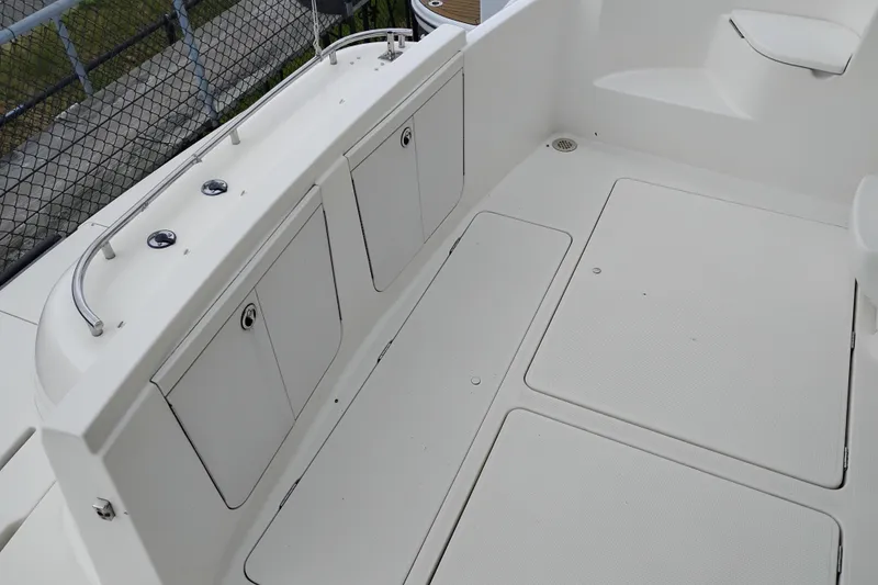 Slide: The Image of 2006 Meridian 411 Sedan boat deck with storage compartments and railing. - 5