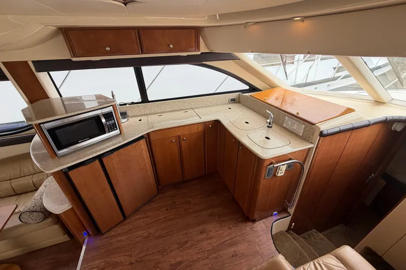 Slide: The Image of Interior of 2006 Meridian 411 Sedan yacht with modern kitchen amenities. - 50