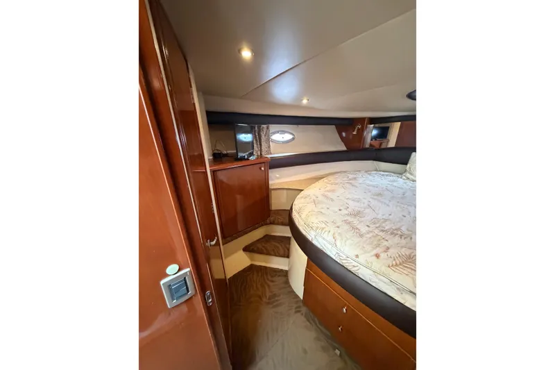 Slide: The Image of Luxurious cabin interior of 2006 Meridian 411 Sedan yacht with cozy bed and wood finish. - 53