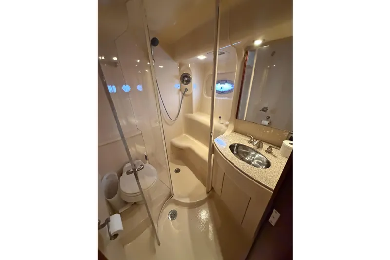 Slide: The Image of Luxurious bathroom in a 2006 Meridian 411 Sedan yacht, featuring a shower and sink. - 55