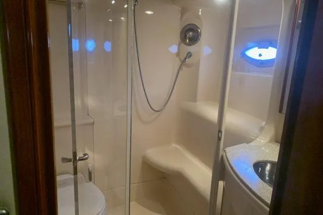 Slide: The Image of Bathroom interior of 2006 Meridian 411 Sedan yacht with shower and sink. - 56