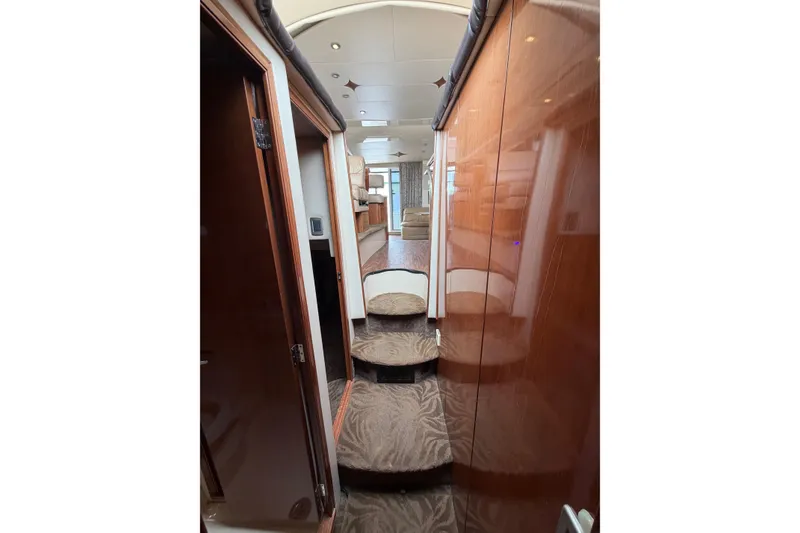 Slide: The Image of Interior view of 2006 Meridian 411 Sedan yacht with carpeted stairs and wooden paneling. - 61