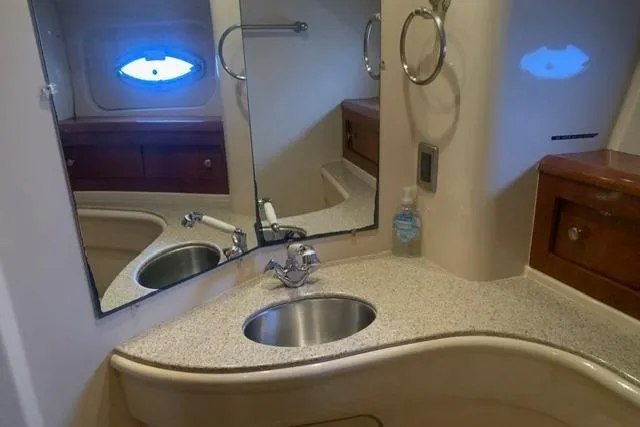 Slide: The Image of Bathroom interior of 2006 Meridian 411 Sedan yacht with sink and mirror. - 65