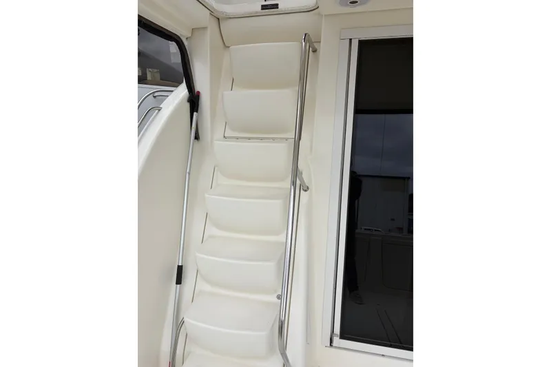 Slide: The Image of Staircase inside 2006 Meridian 411 Sedan yacht with stainless steel handrail. - 7