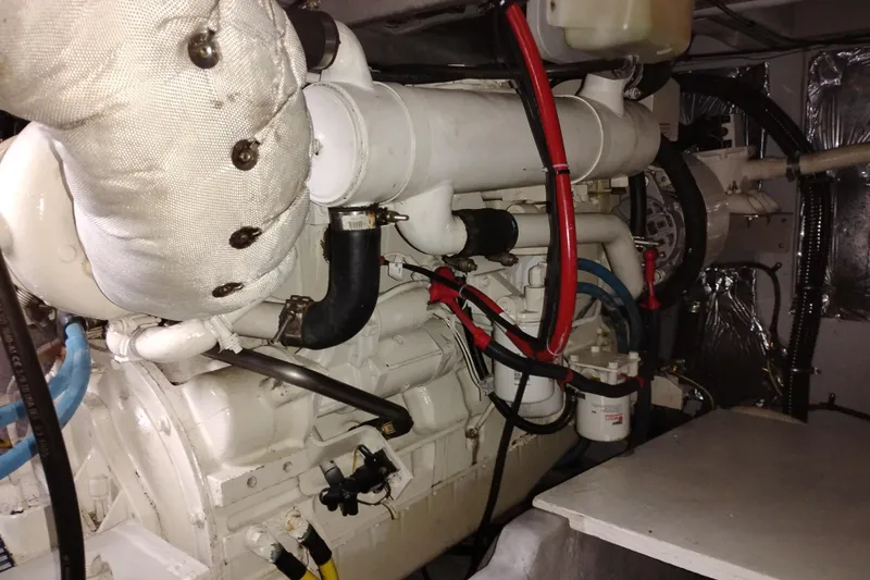 Slide: The Image of Engine room of a 2006 Meridian 411 Sedan yacht, showcasing mechanical components. - 75